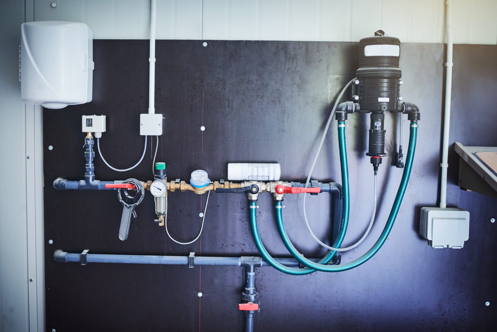 Everything has its place. Shot of equipment mounted against a wall in a factory