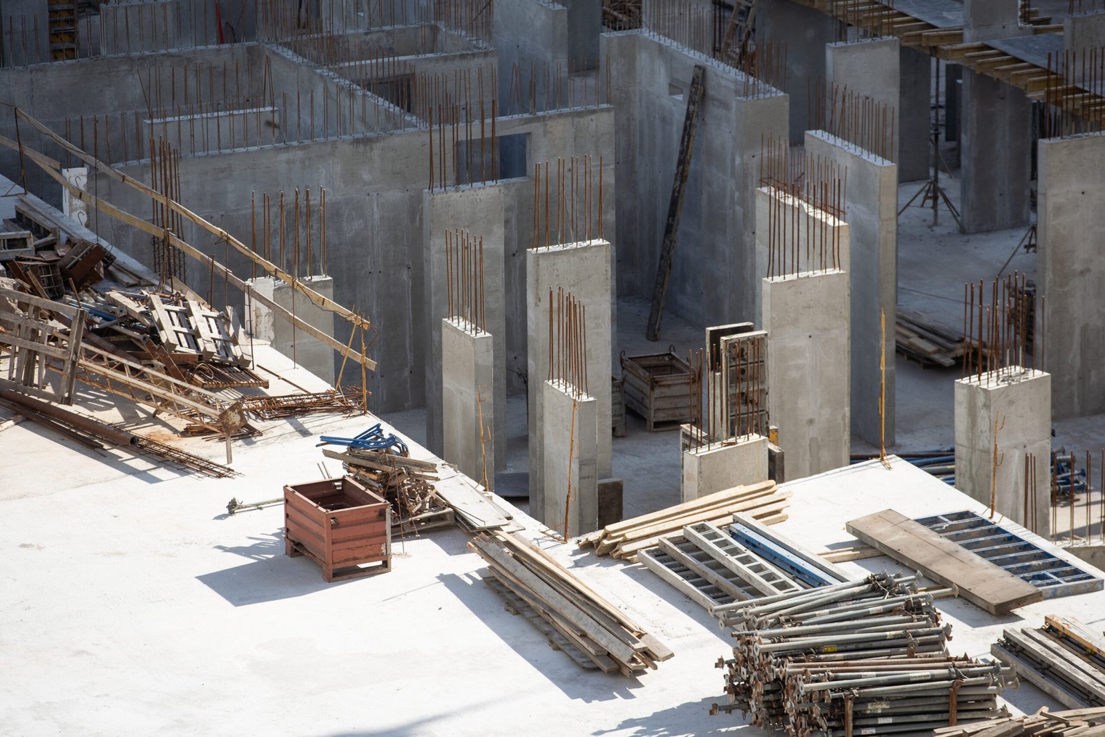 Warehouse Construction from metal structure. Industrial building on light gauge steel framing. Frame of modern hangar or factory. Construction site with steel structure warehouse. Top view on a roof. High quality photo